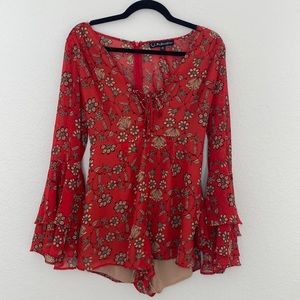 A beautiful romper from for love and lemons and Red floral print